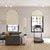 Lifestyle room scene of a contemporary living room featuring the blackout cellular arch in the ivory color.