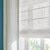 Detailed close up of the roman shades in the alameda bright white color.